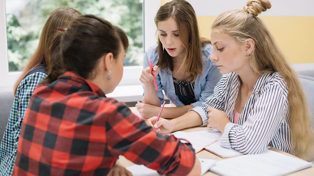 A group of girls collaborating.